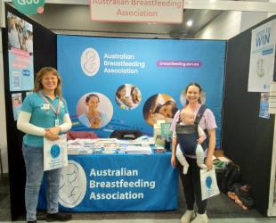Two volunteers at a baby expo stand